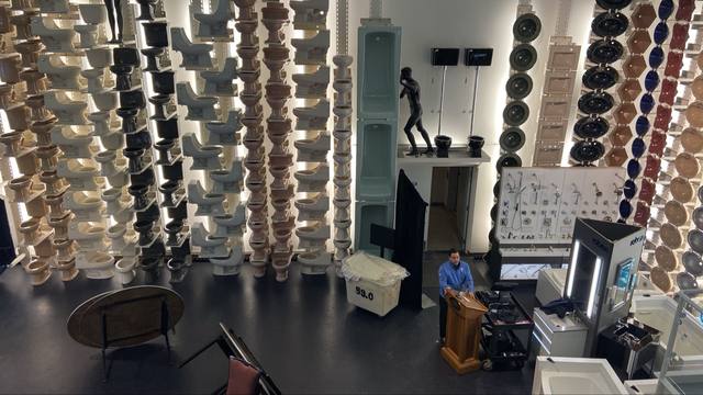 Design Center fixture wall, toilets stacked floor to ceiling