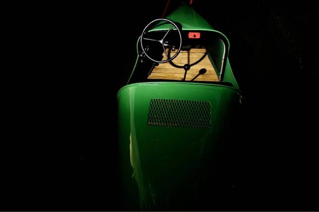 green vintage racer cockpit shot from above, wooden floorboards) — two more images for #4, joining the collage already deploying