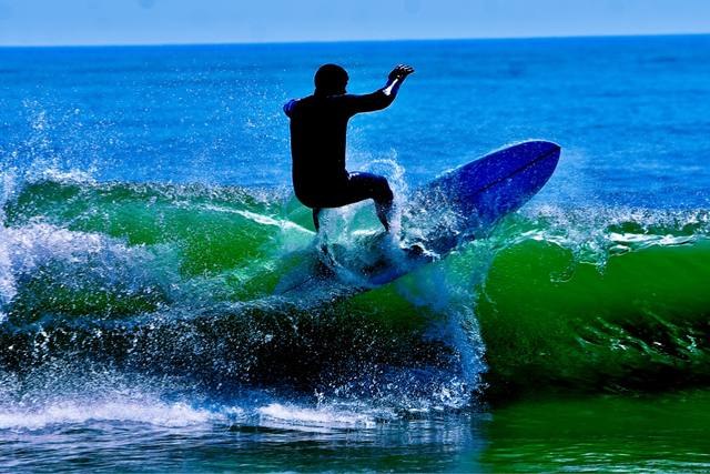 surfer riding a blue wave) — join the already-staged surf poster; #57 and #58 now have three images each