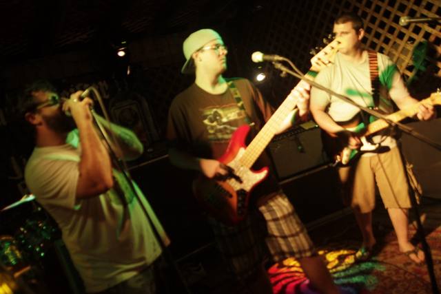 three-piece band on stage
