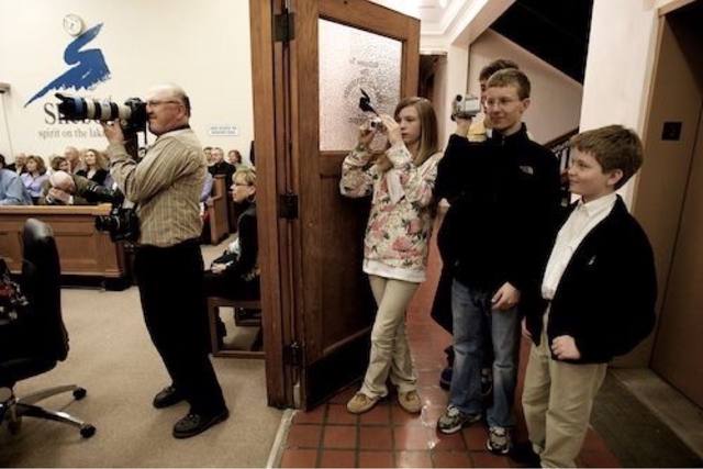 kids with cameras photographing the inauguration, Mike with the long telephoto lens in frame
