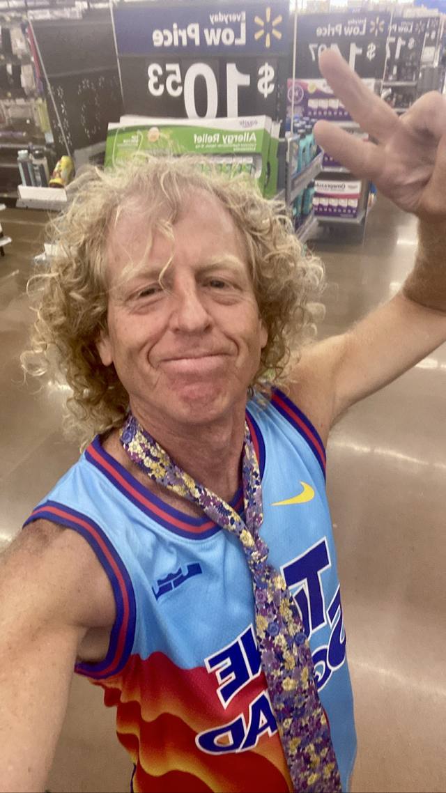 Mike at Walmart, Nike jersey, floral tie, peace sign