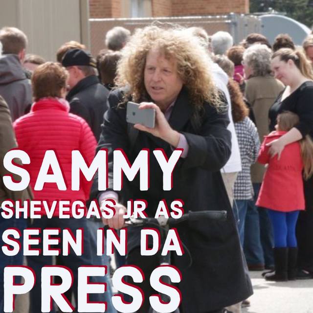 "SAMMY SHEVEGAS JR AS SEEN IN DA PRESS," Mike with camera in a crowd