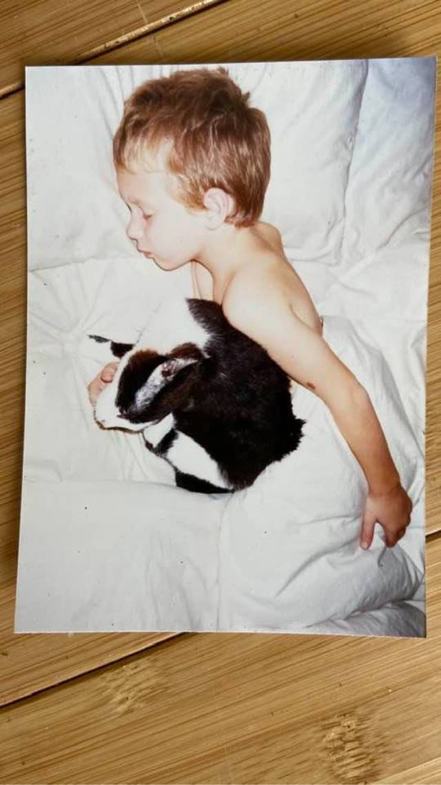 sleeping boy with the black-and-white cat (photo of a print